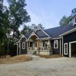 Front view of a house with dark blue exterior paint by Reardon Painting.